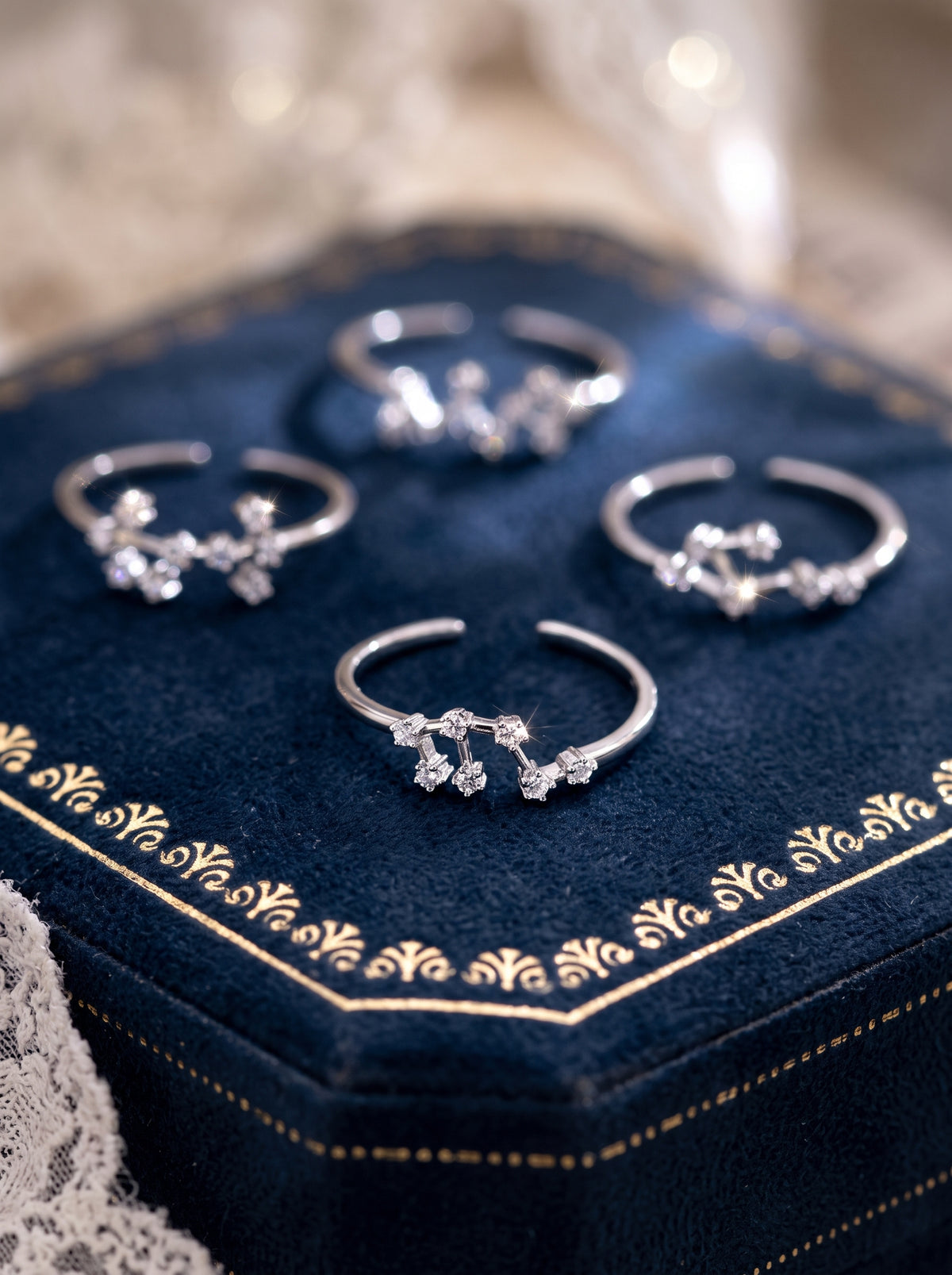 Celeste zodiac sterling silver ring collection in a jewelry box