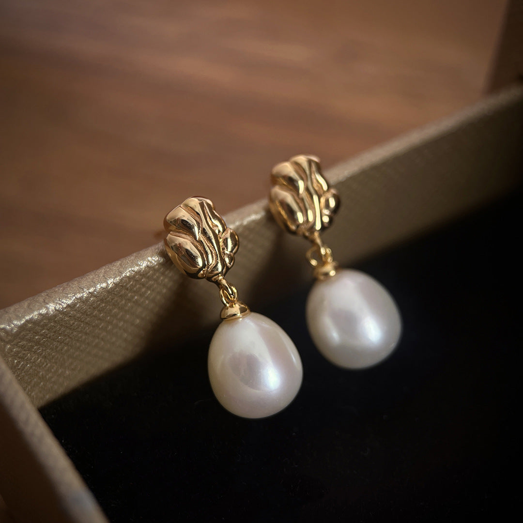 Close-up of Elara earrings with luminous natural freshwater pearls