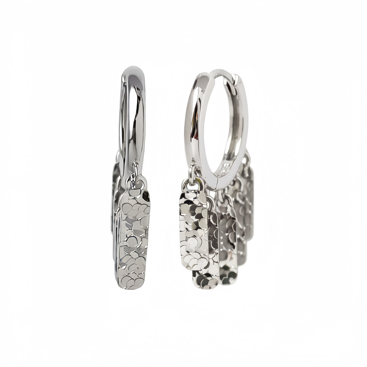 Silver Luma hammered fringe hoop earrings on a white background