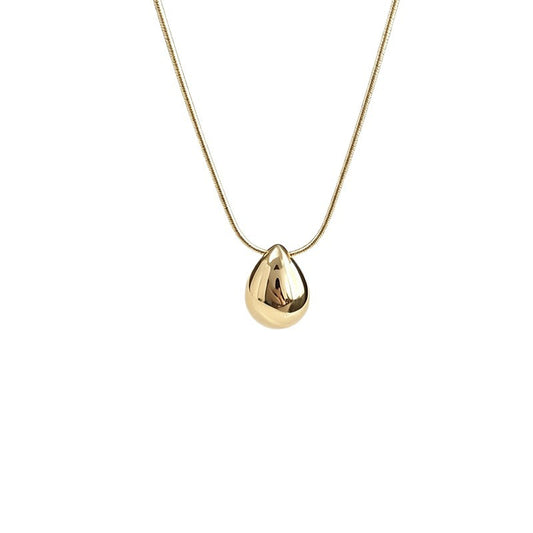 Aqua sculptural drop necklace on a white background