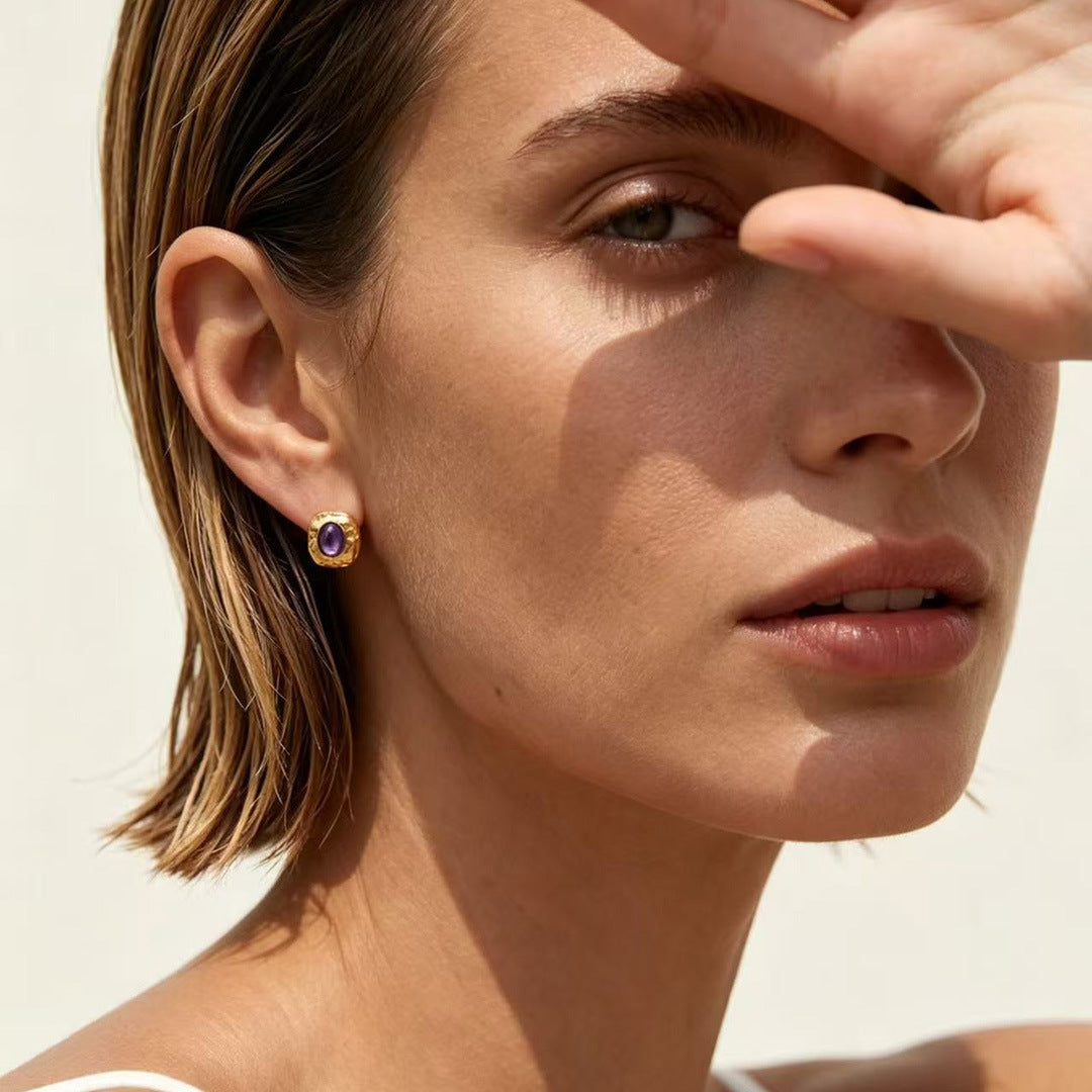 Gold-plated sterling silver stud earrings with natural purple charoite