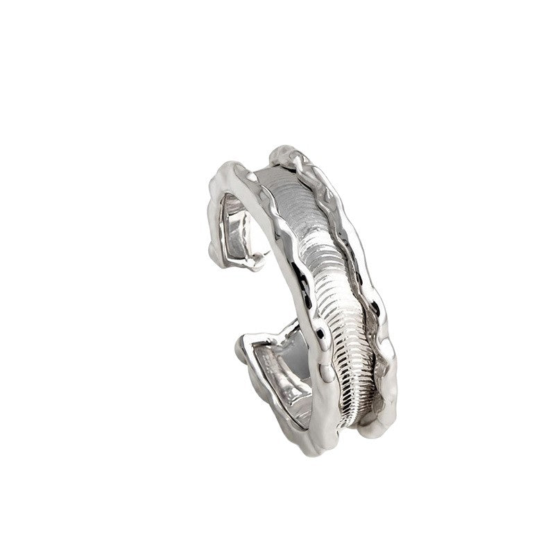 Close-up of Riva silver ring with sculptural wave texture