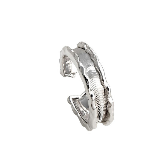 Close-up of Riva silver ring with sculptural wave texture