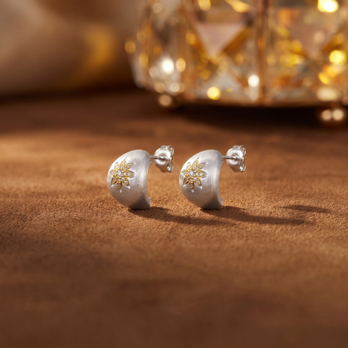 Close-up of Astra two-tone zircon stud earrings
