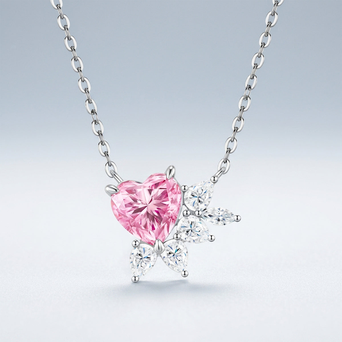Pink heart-cut moissanite pendant accented with white moissanite stones