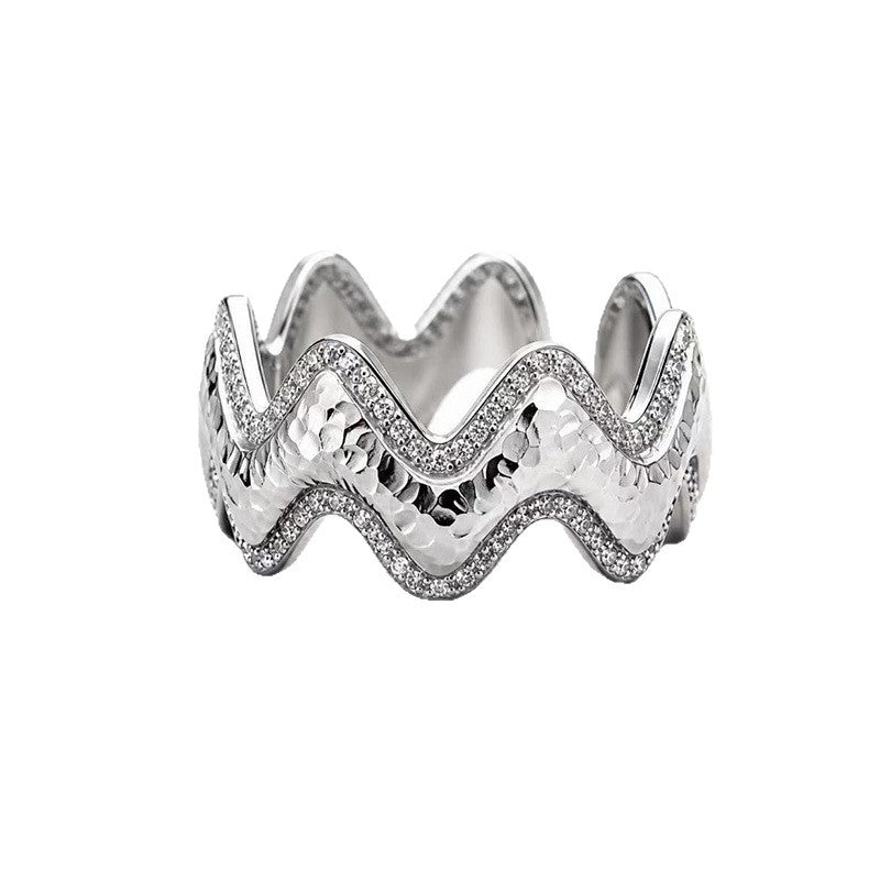 Close-up of Vela silver wave ring with pavé zircon accents