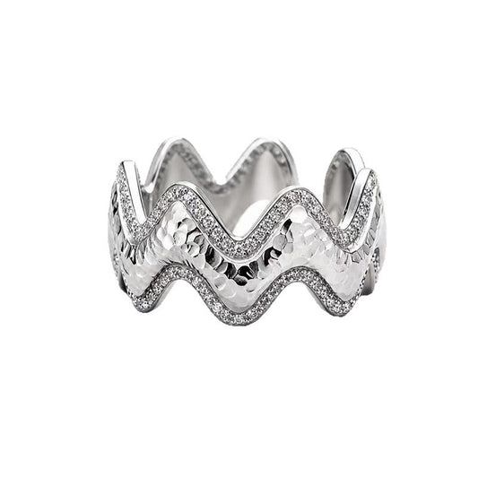 Close-up of Vela silver wave ring with pavé zircon accents