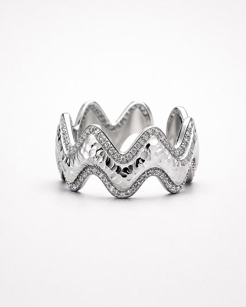 Close-up of Vela silver wave ring with pavé zircon accents