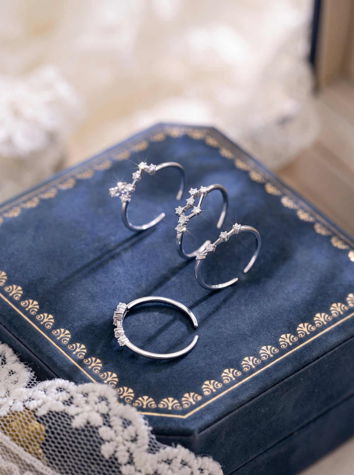 Celeste zodiac sterling silver ring collection in a jewelry box