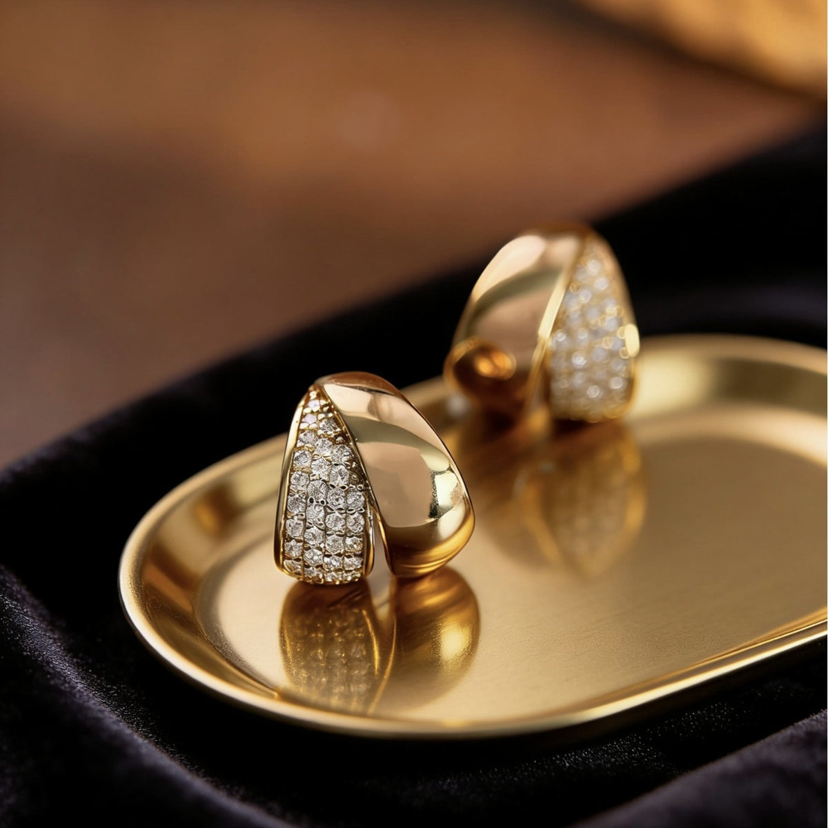 Polished sterling silver stud earrings with pavé zircon detailing