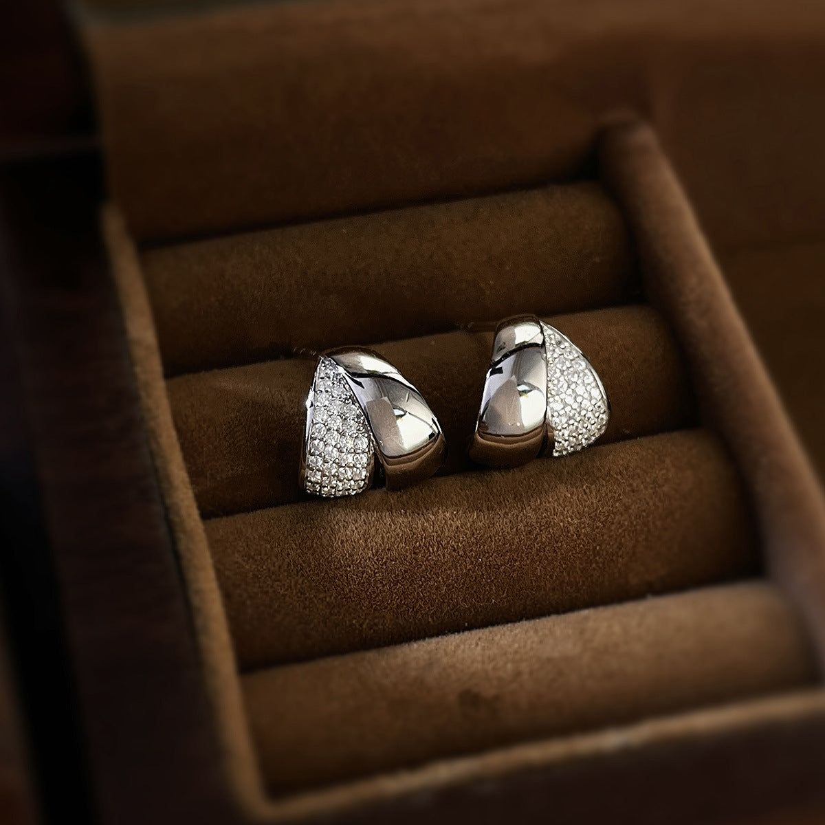 Polished sterling silver stud earrings with pavé zircon detailing