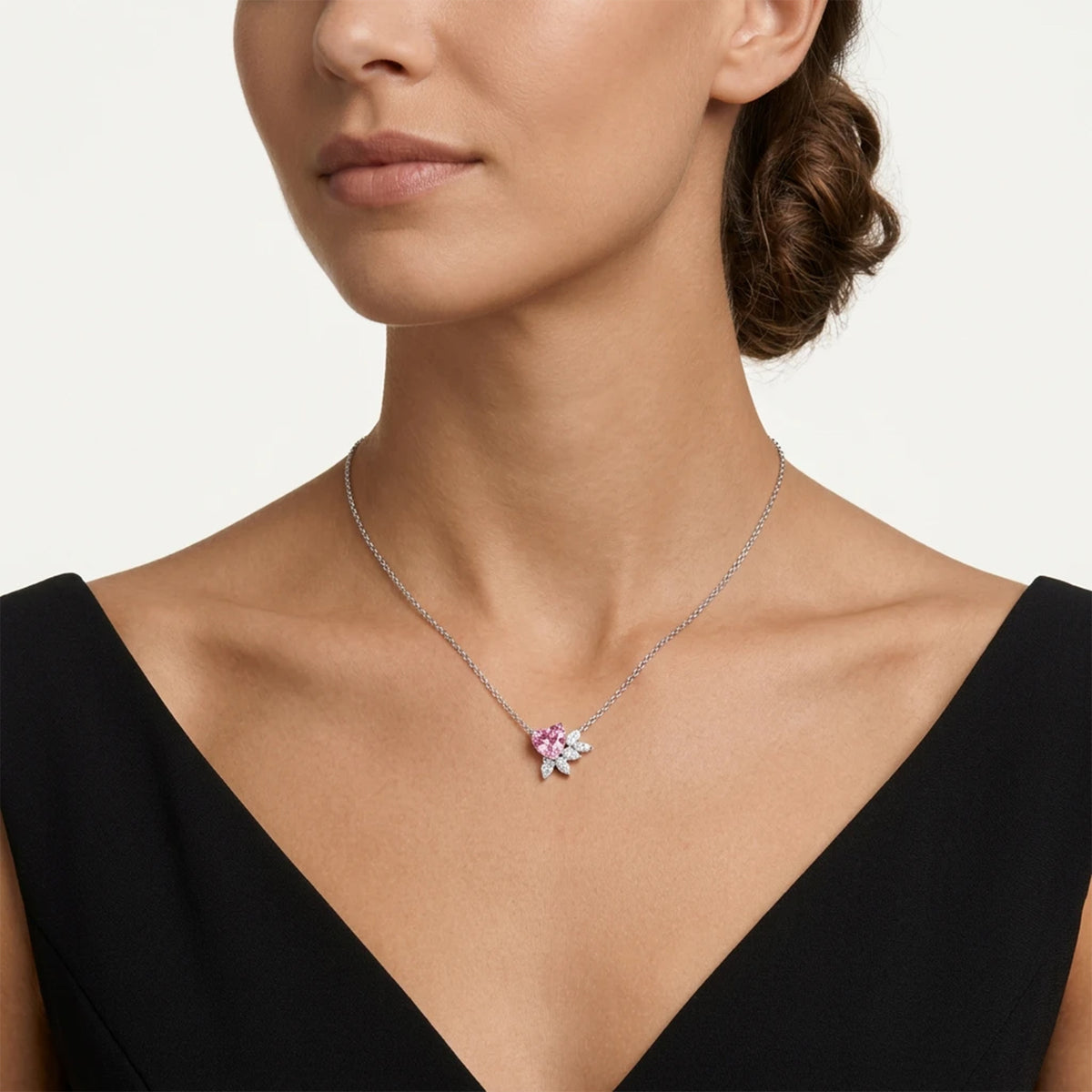 Pink heart-cut moissanite pendant accented with white moissanite stones