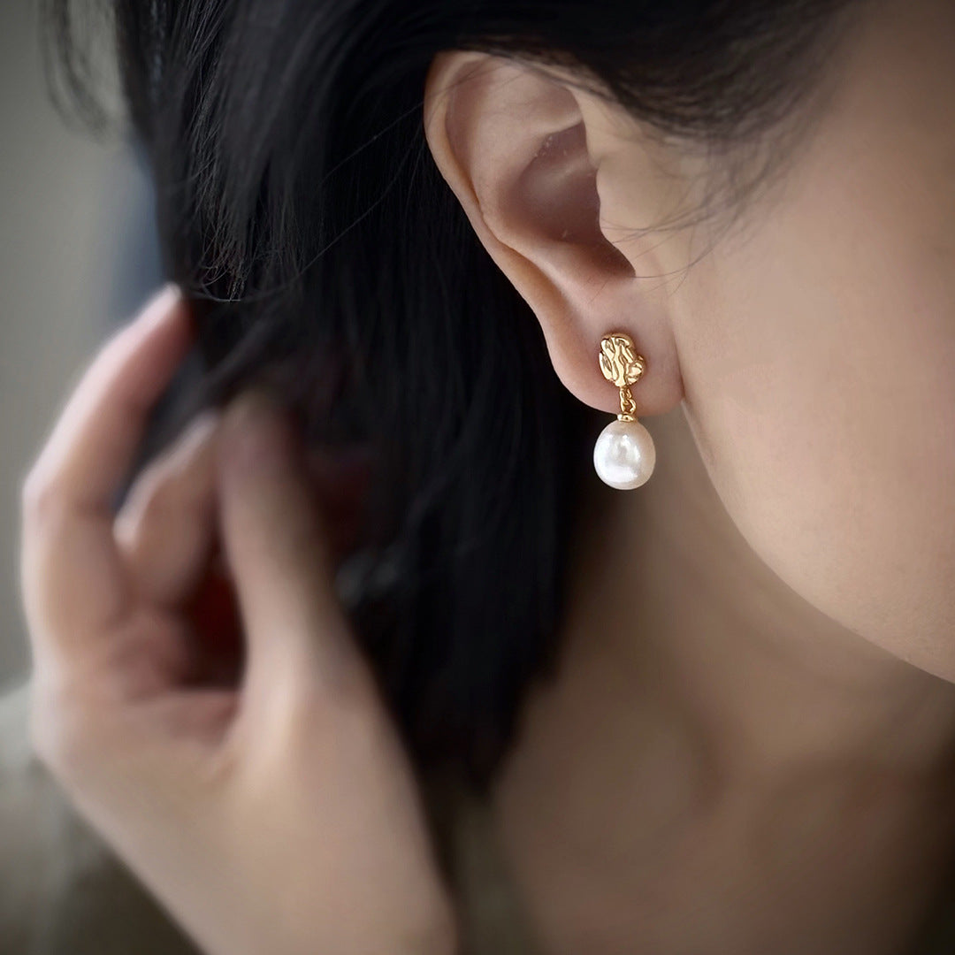 Close-up of Elara earrings with luminous natural freshwater pearls